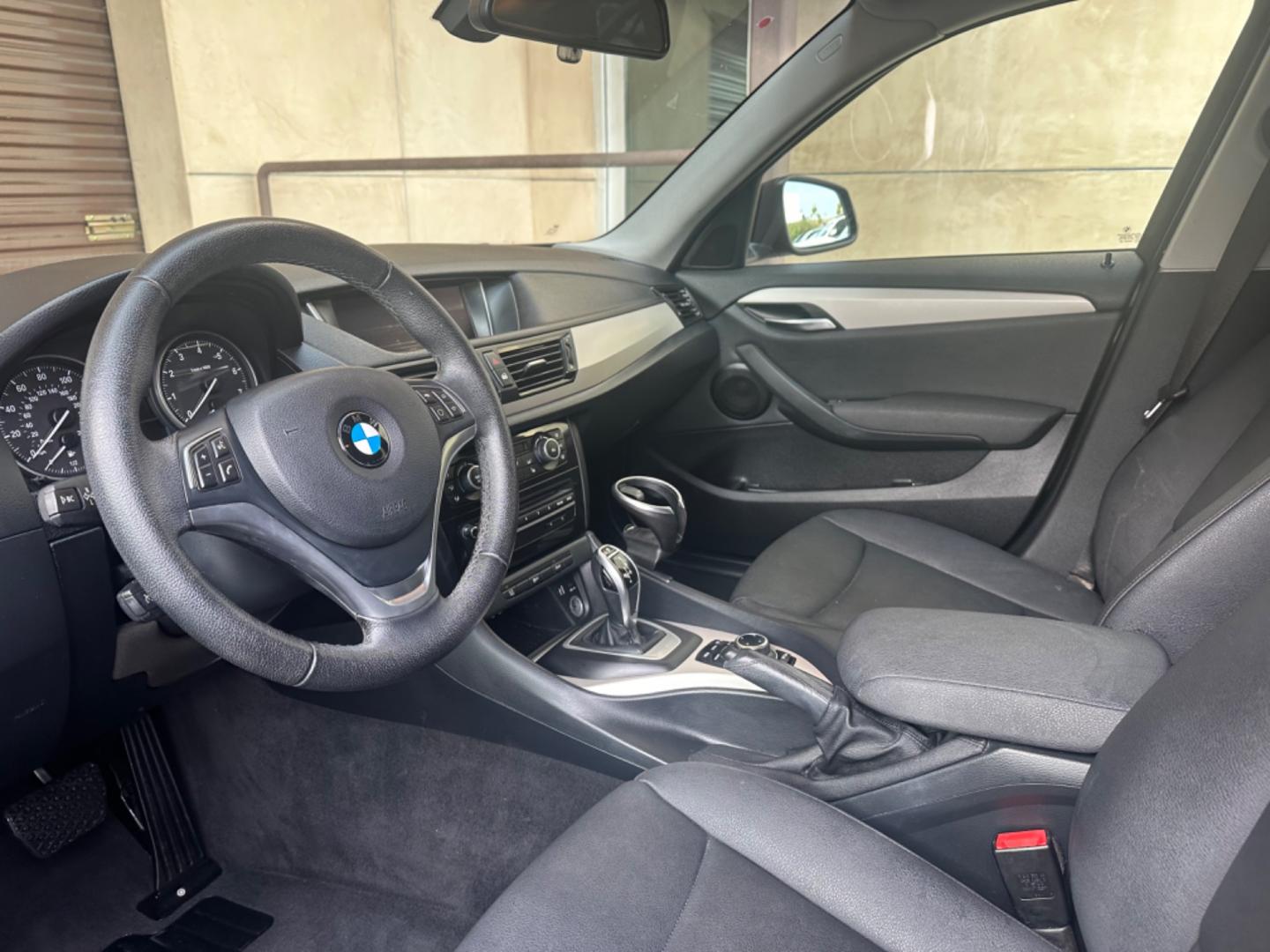 2014 Black /Black BMW X1 (WBAVM1C57EV) with an 4 CYLINDER engine, Automatic transmission, located at 30 S. Berkeley Avenue, Pasadena, CA, 91107, (626) 248-7567, 34.145447, -118.109398 - Photo#9